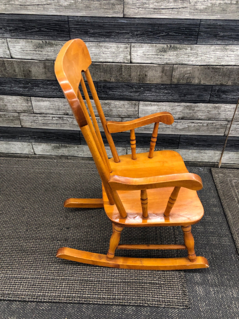 TAN CHILDRENS ROCKING CHAIR.