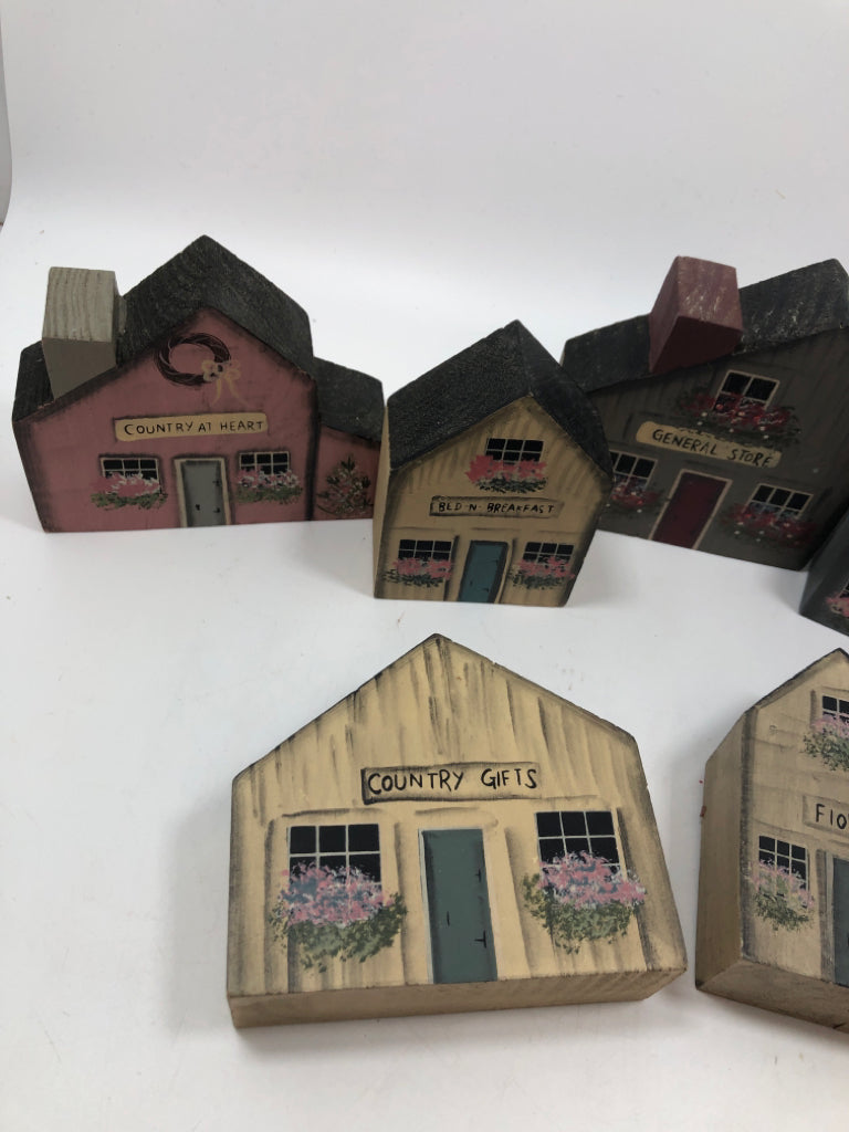 7 WOOD PAINTED BLOCK HOUSES IN BAG.