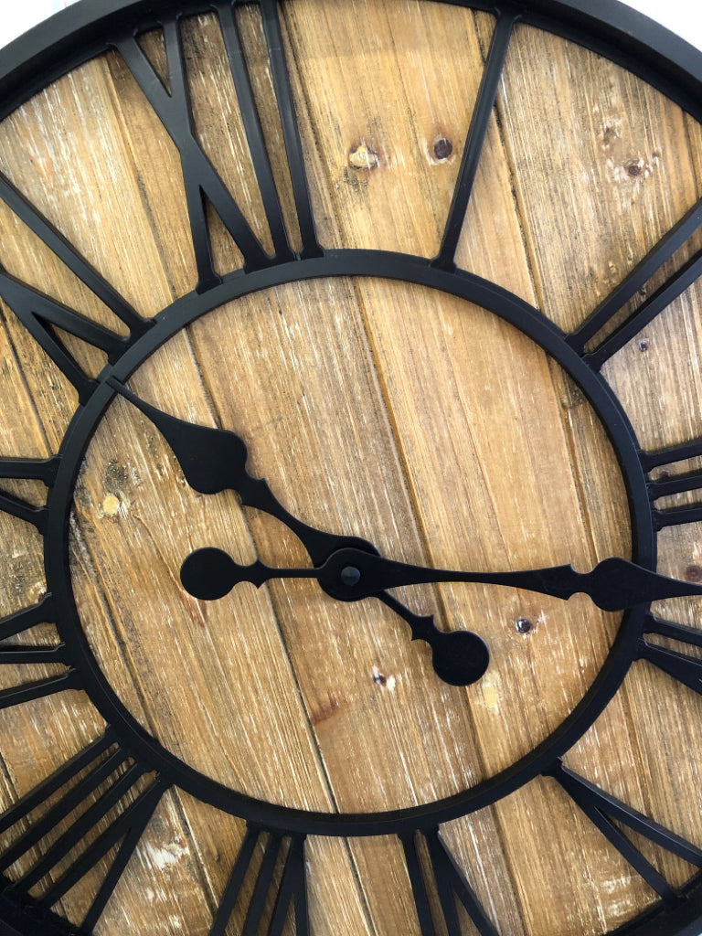 LARGE WOOD CLOCK W/ROMAN NUMERALS & BLACK BORDER.