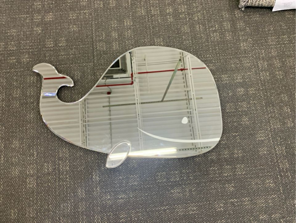 LARGE WHALE SHAPED MIRROR.