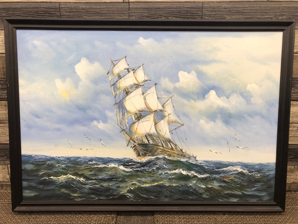 LARGE SHIP ON WATER W/ SEAGULLS IN BLACK FRAME WALL HANGING.
