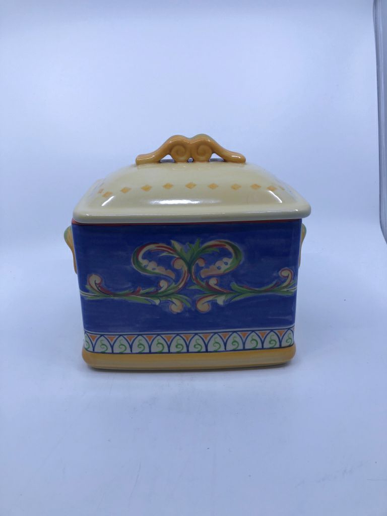 YELLOW AND BLUE COVERED CANISTER.