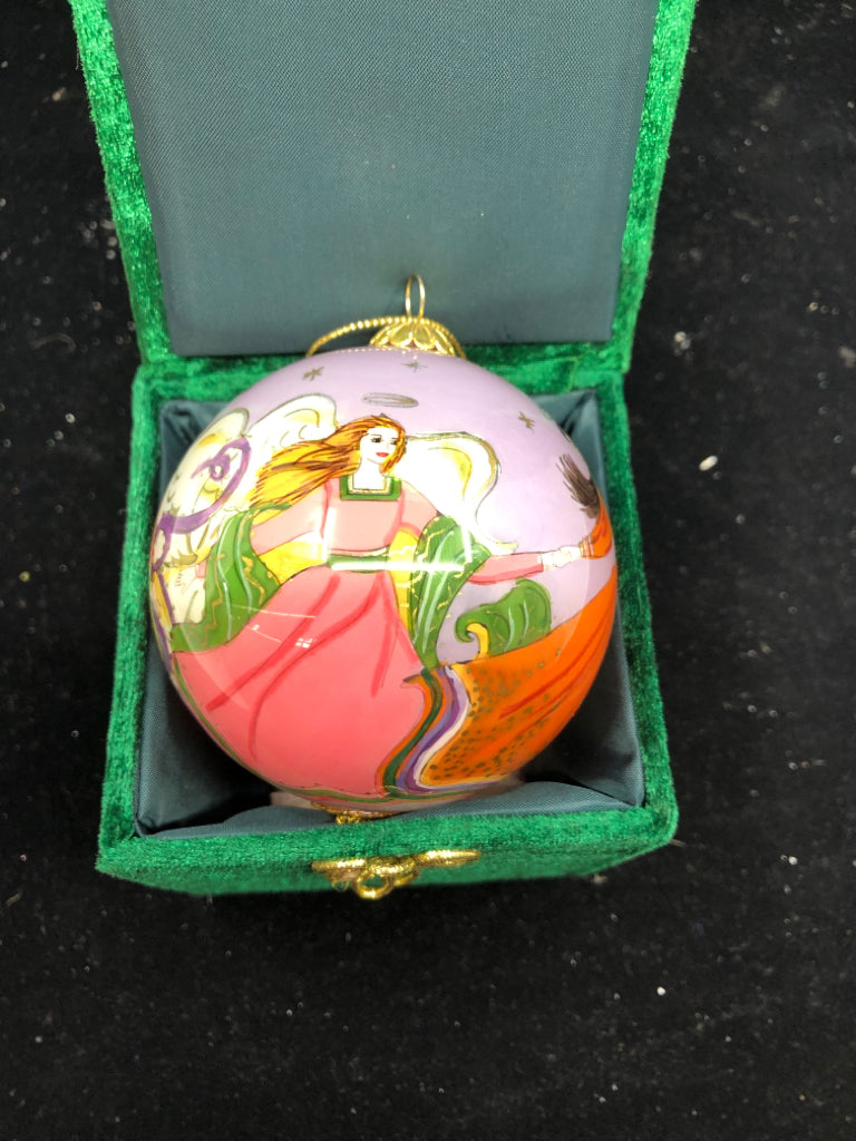 PURPLE ANGLE SPHERE ORNAMENT IN GREEN BOX.