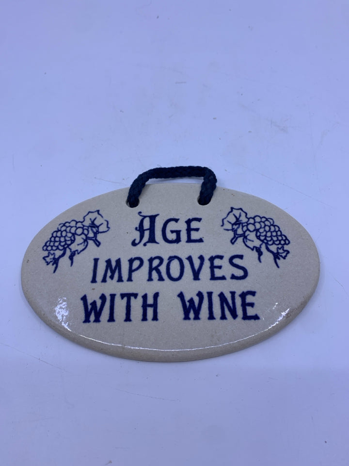 "AGE IMPROVES WITH WINE" OVAL POTTERY SIGN.