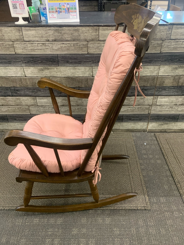 MEDIUM WOOD ROCKING CHAIR WITH GOLD FLOWER DESIGN.