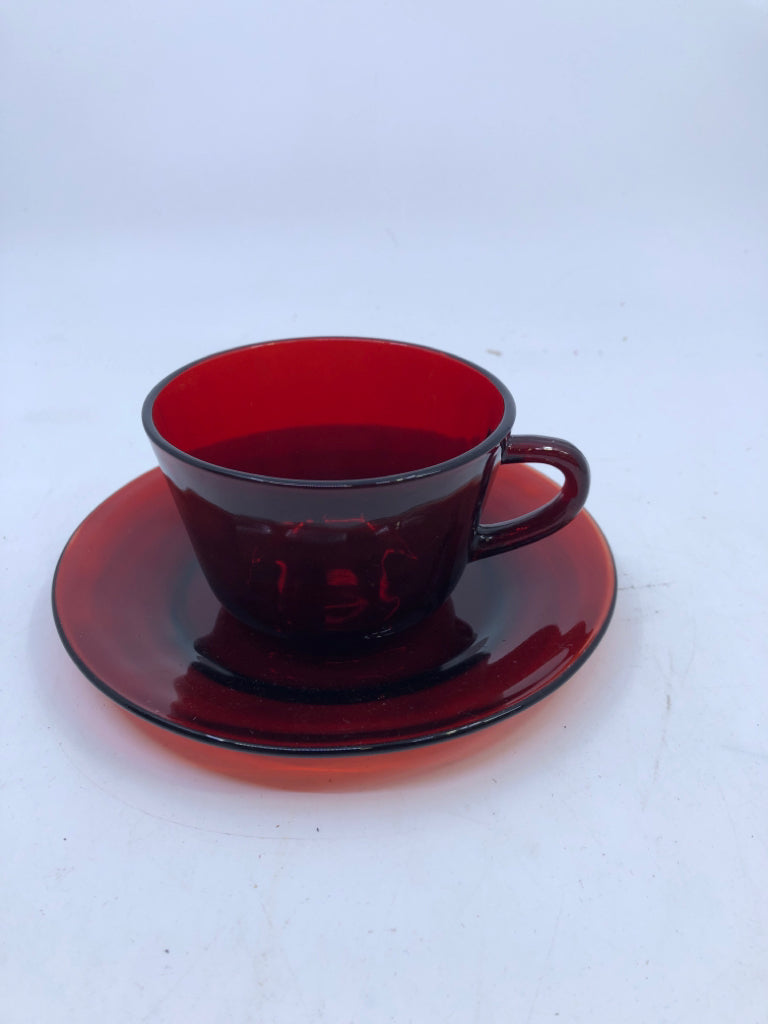 RED GLASS TEACUP AND SAUCER.
