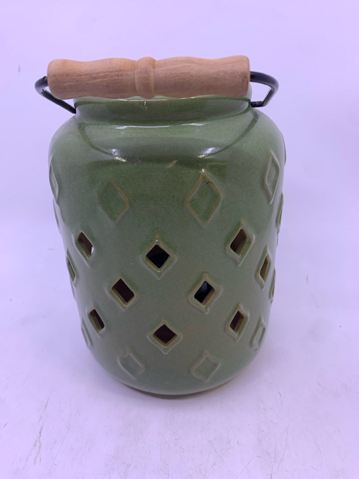GREEN CERAMIC PIERCED CANDLE LANTERN.