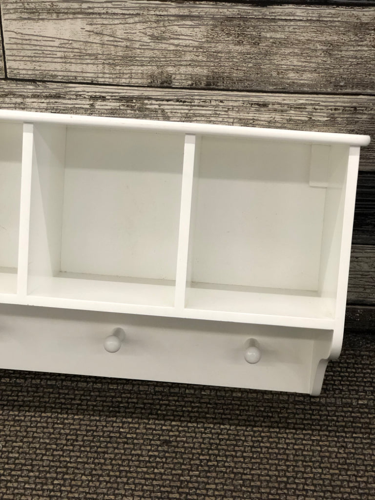 WHITE CUBBY WALL SHELF W/COAT HOOKS.