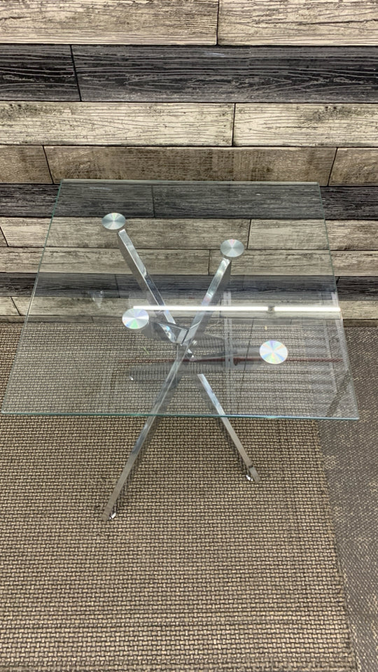 GLASS TOP SILVER METAL BASE SIDE TABLE.