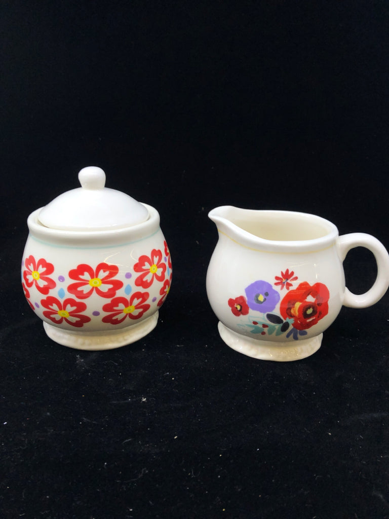 2 PC WHITE W/ RED/PURPLE FLOWERS SUG/CREAMER SET.
