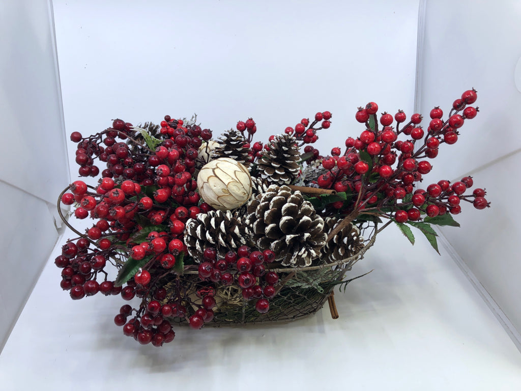 BASKET FULL OF FAUX HOLIDAY ARRANGEMENT.