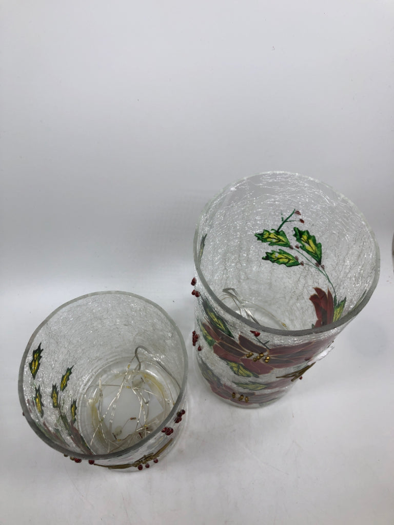 2 LED POINSETTIA HURRICANE LIGHTS IN BOX.