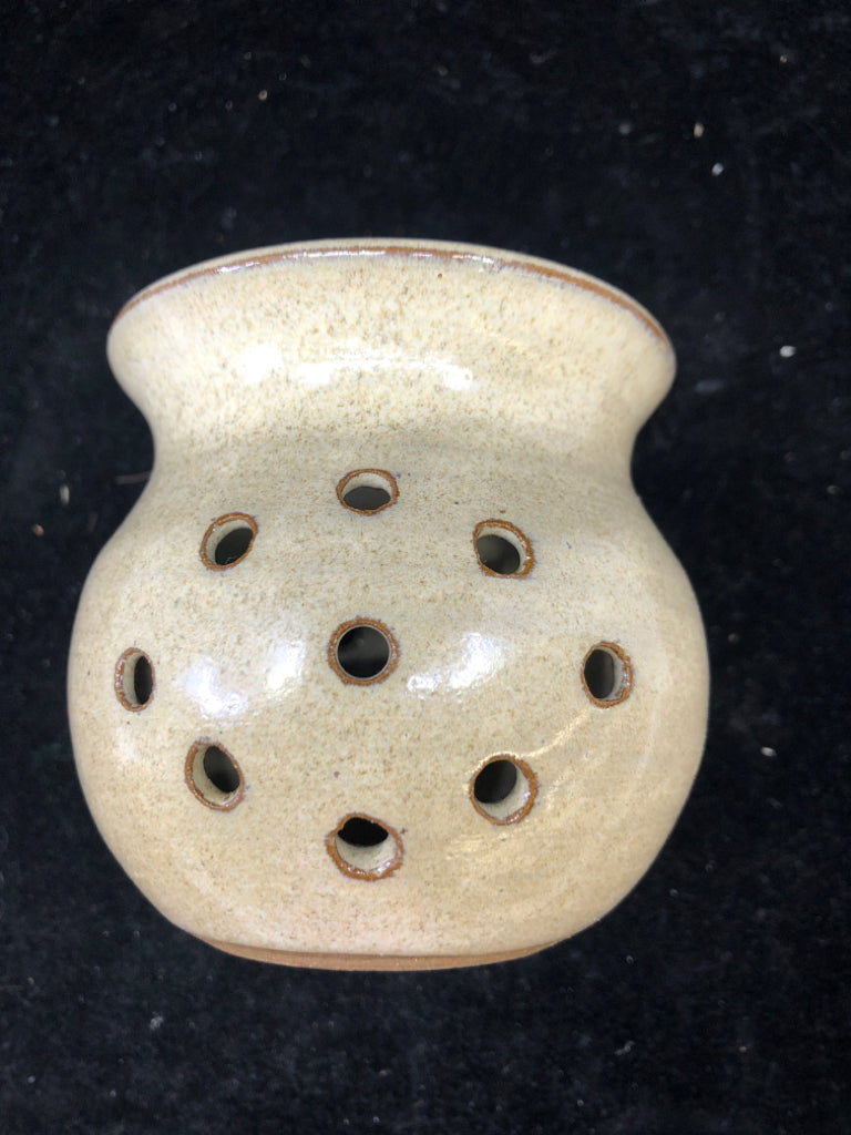 GRAY POTTERY TEA LIGHT HOLDER.