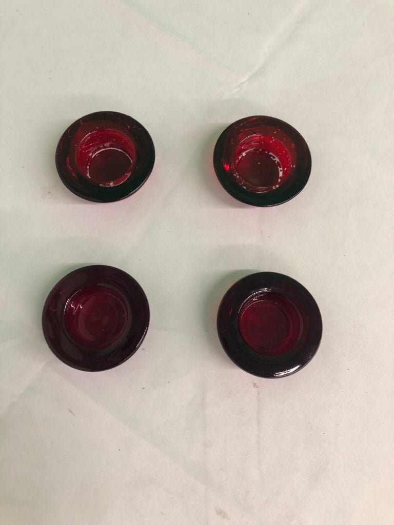 4 RED GLASS TEA LIGHT HOLDERS.