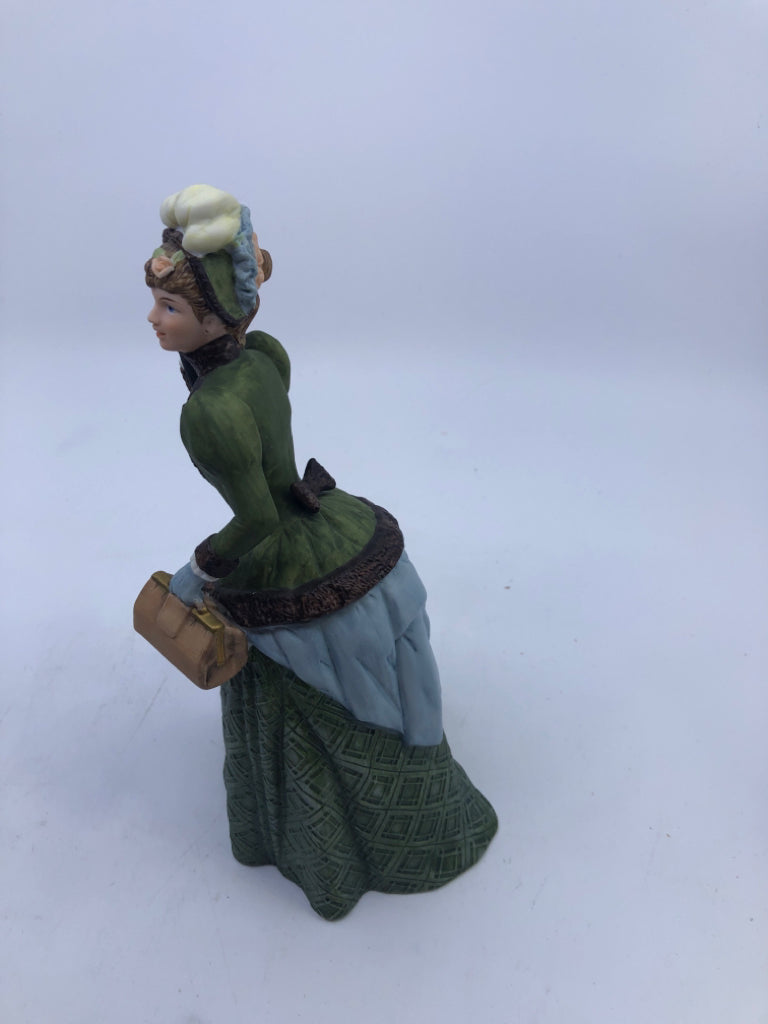 WOMAN IN GREEN DRESS W UMBRELLA- AVON 1987 ALBEE AWARD.