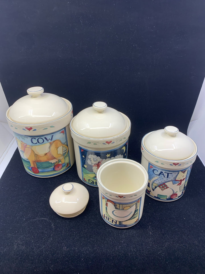 4 PRIMITIVE ANIMAL CANISTERS.