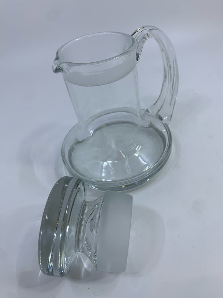 GLASS DECANTER W/HANDLE & FROSTED LID STOPPER.