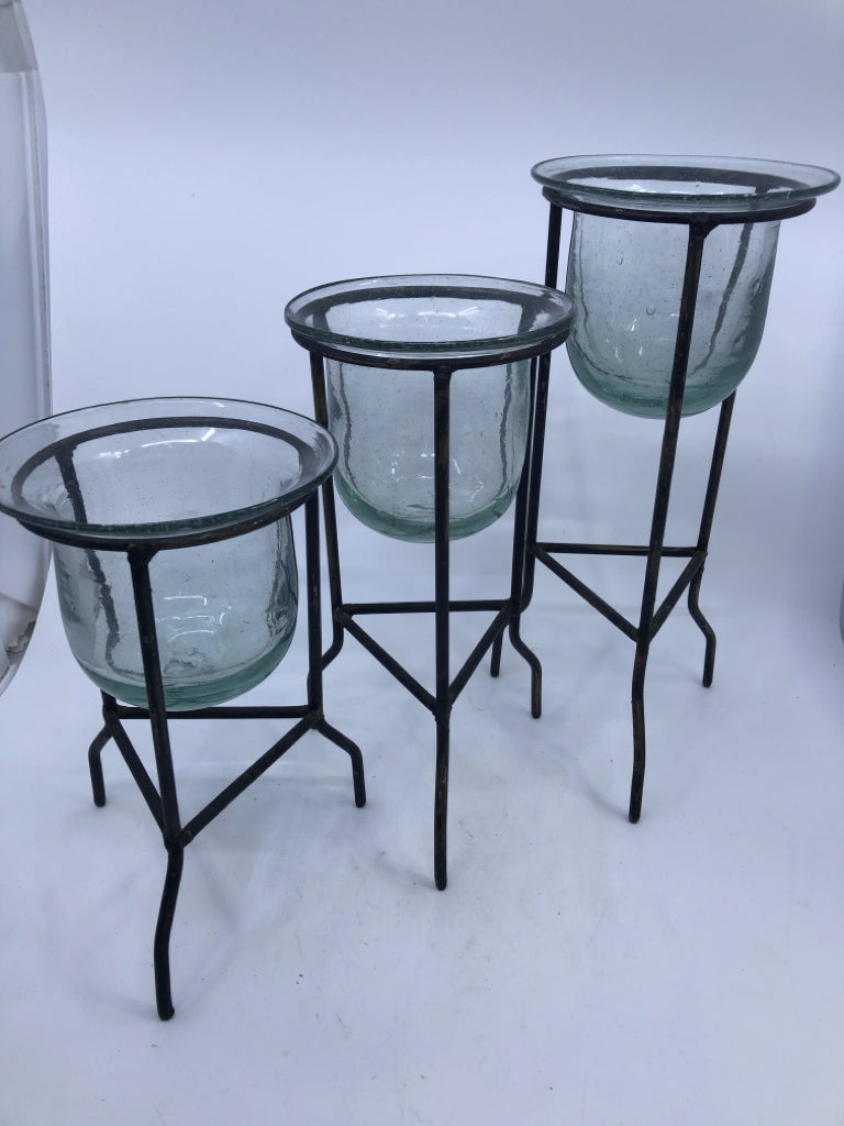 3 DISTRESSED FOOTED CANDLE HOLDERS W/ GLASS INSERTS.