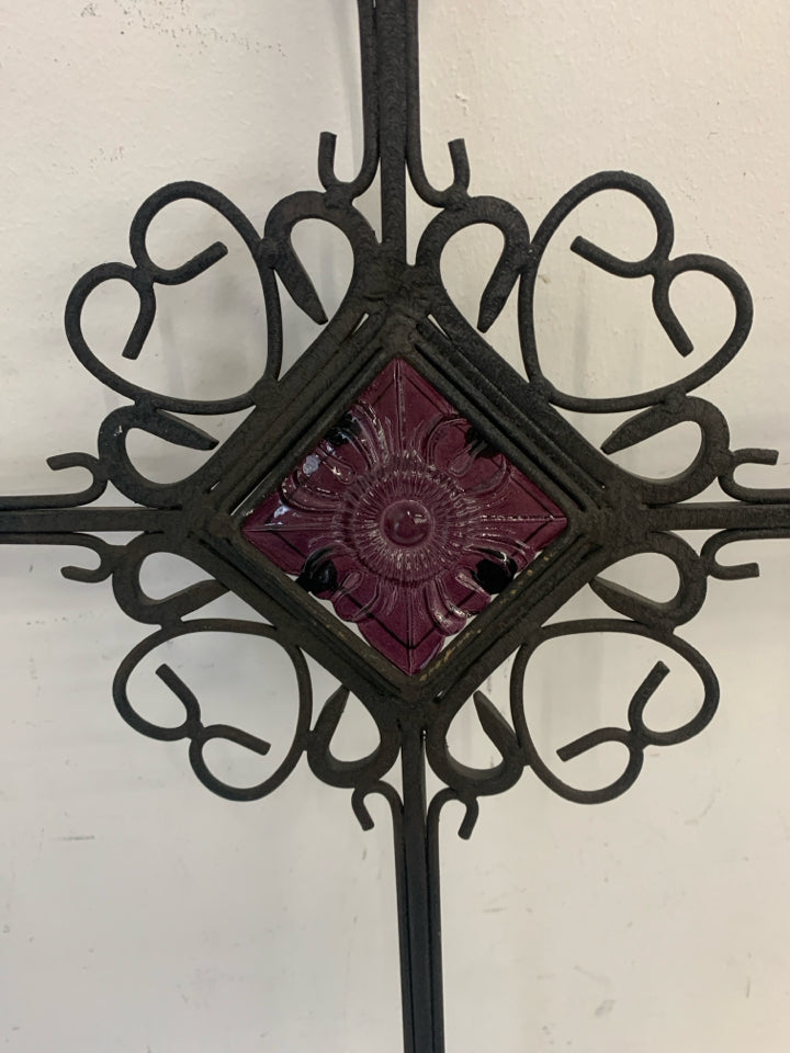 METAL SCROLL CROSS W/PURPLE GLASS IN MIDDLE.