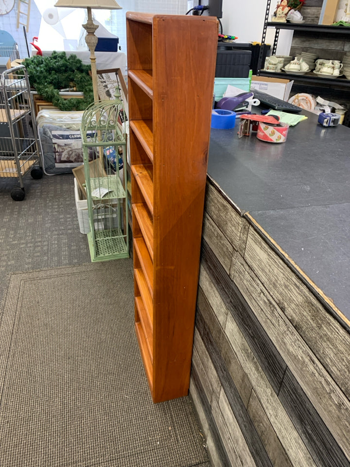 WOODEN 8 SHELF THIN BOOKCASE.