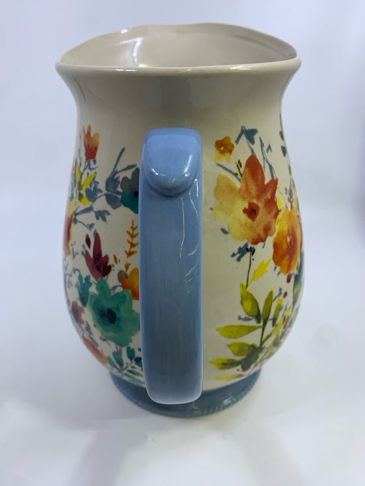 FLORAL PITCHER W/BLUE HANDLE.