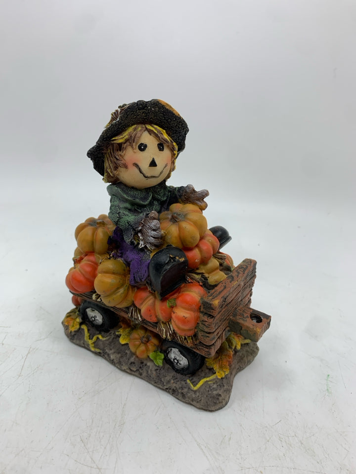 SCARECROW ON PUMPKIN HAY RIDE FIGURINE.