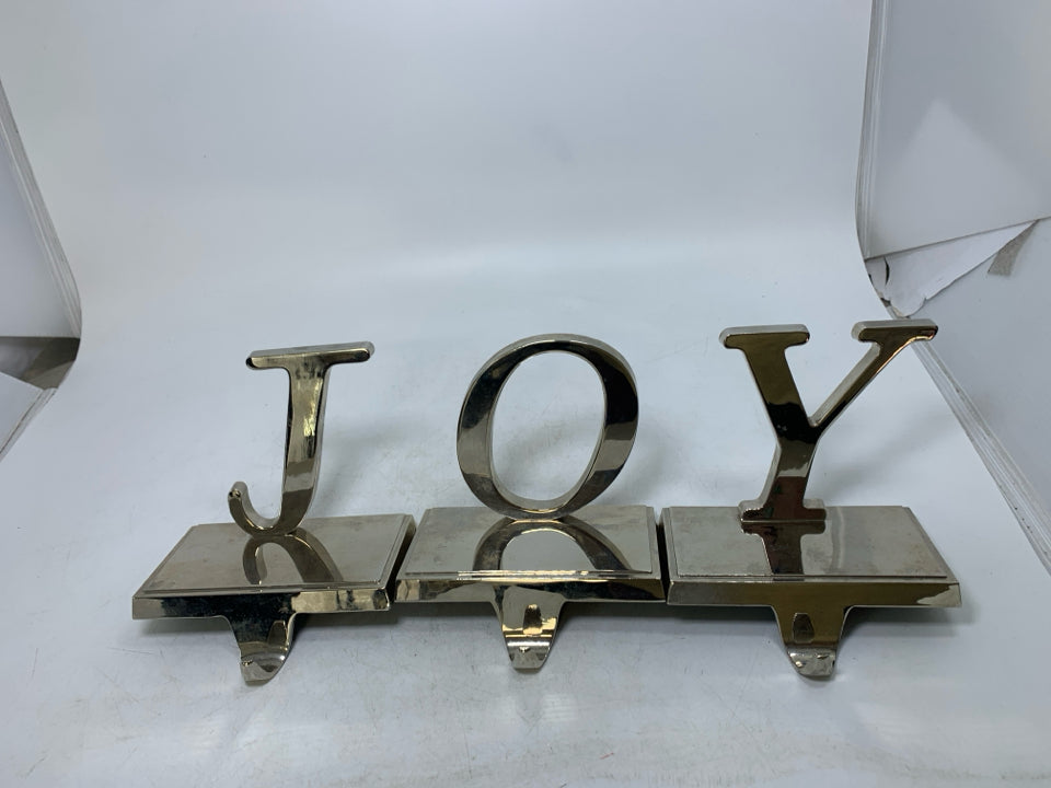 3 SLIVER METAL SOCKING HANGERS SPELLING JOY.