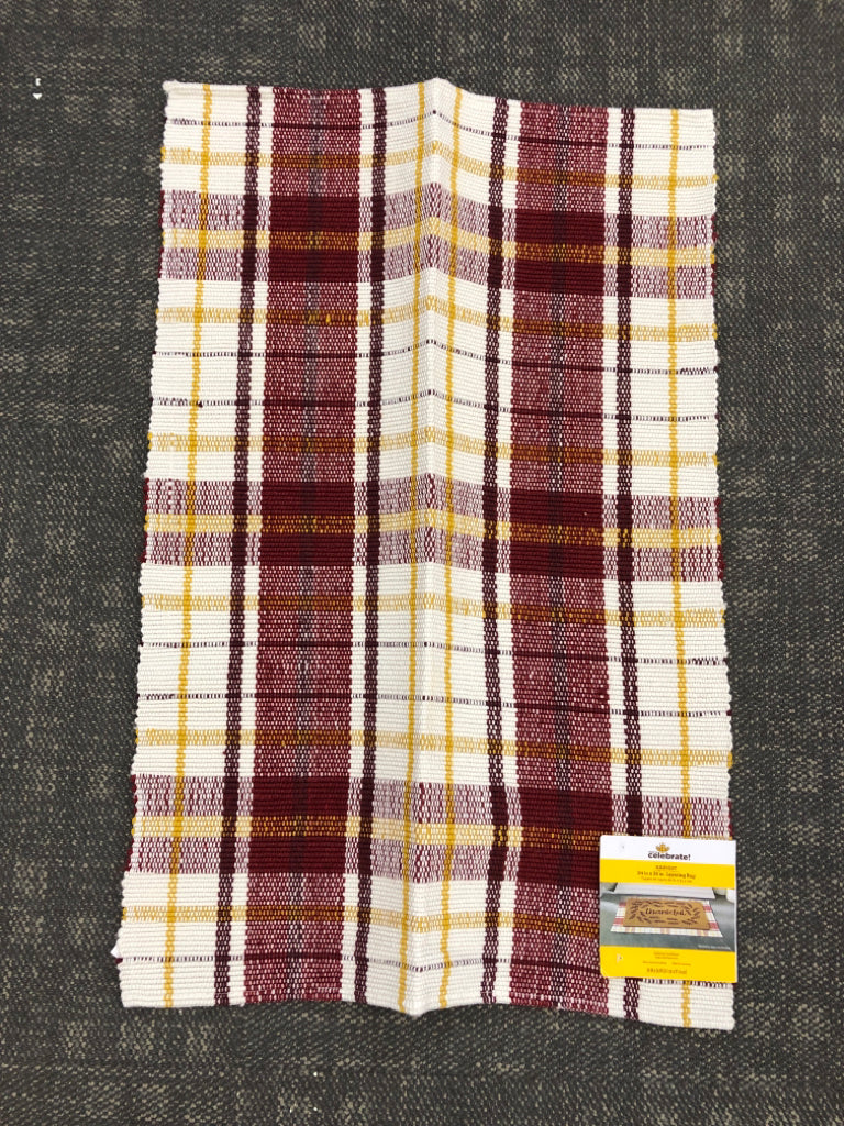 NIP PLAID LAYERING RUG.