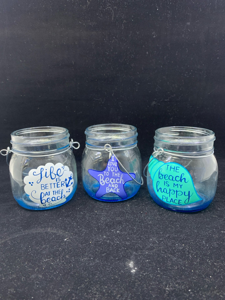 3 BLUE TEA LIGHT HOLDERS.