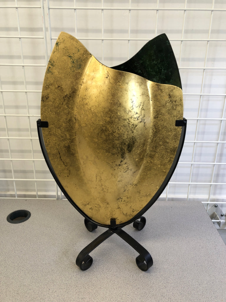 ABSTRACT JASMINE/TEXTURED GOLD GLASS VASE ON BLACK METAL STAND.