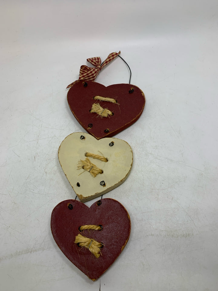3 STACKED HEARTS WALL HANGING.