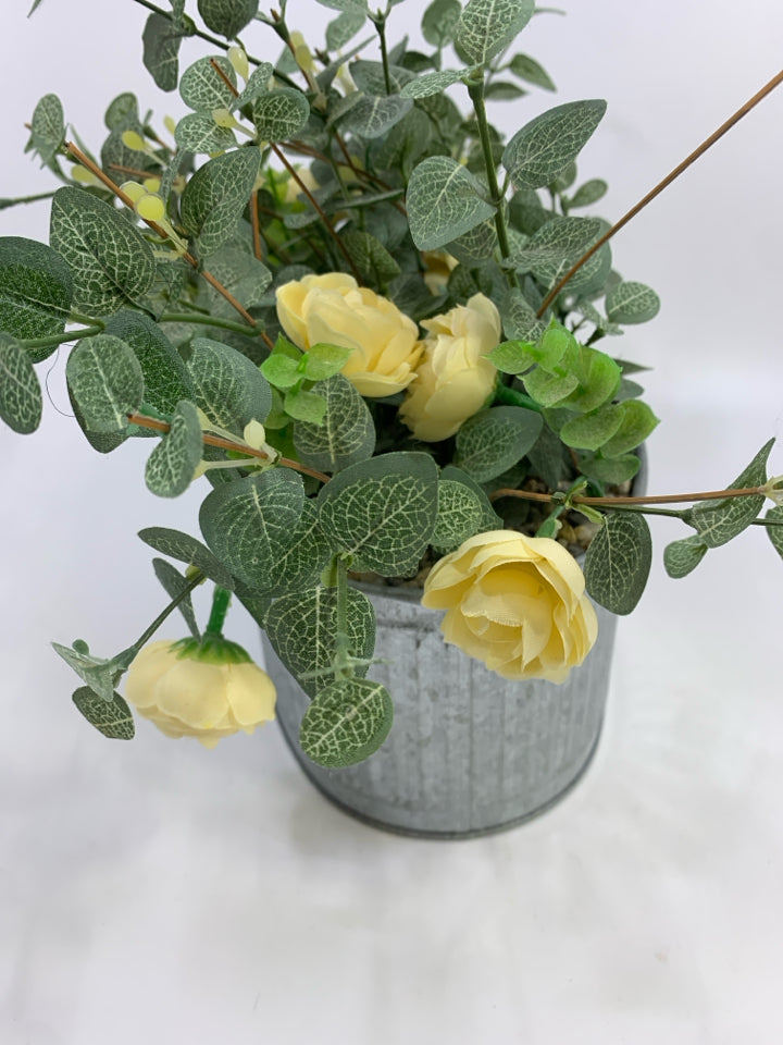 FAUX LEAVES & CREAM FLOWERS IN GALVANIZED TIN.