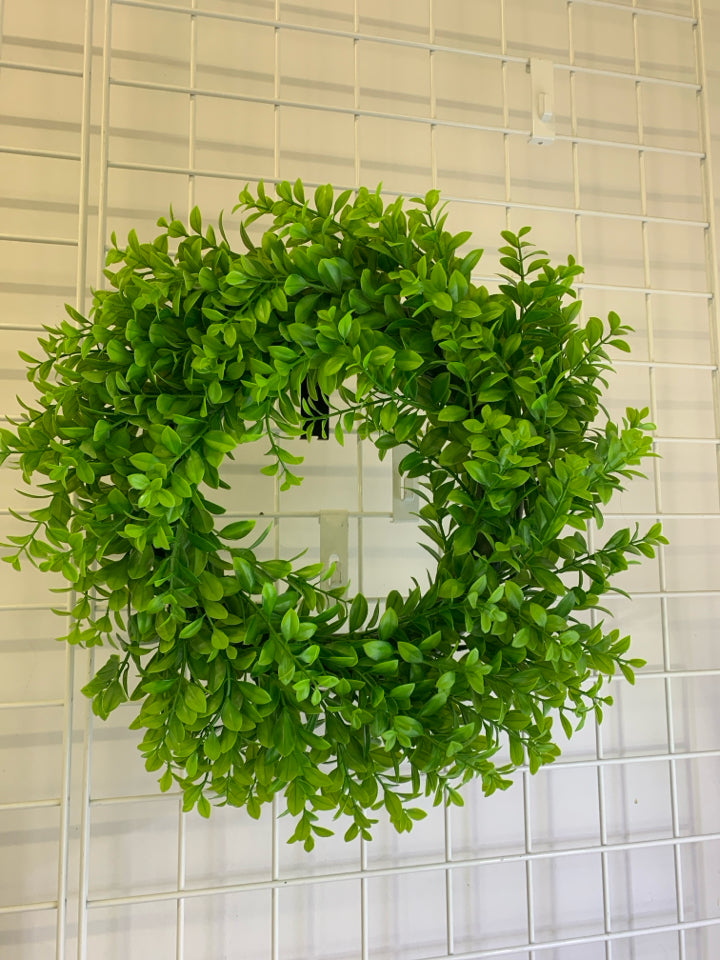 PLASTIC GREENS WREATH.