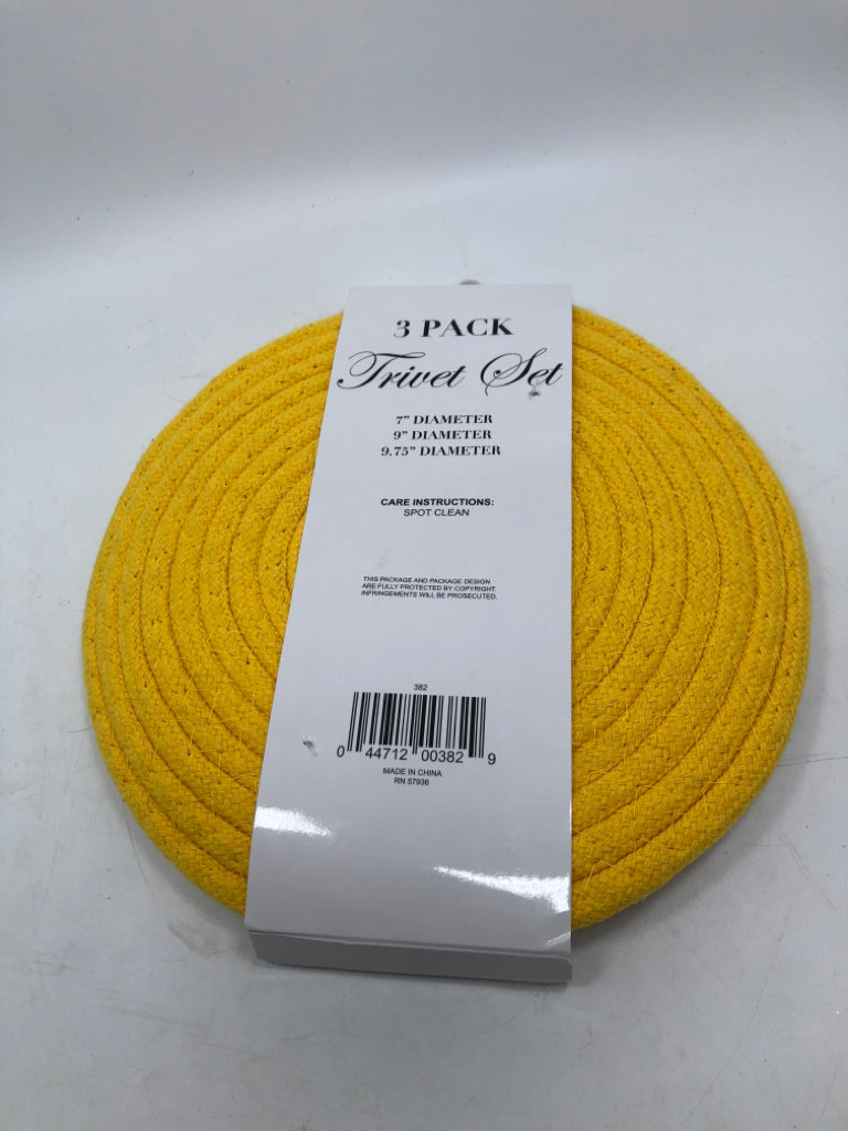 NWT YELLOW AND GREY 3 PACK TRIVET SET.