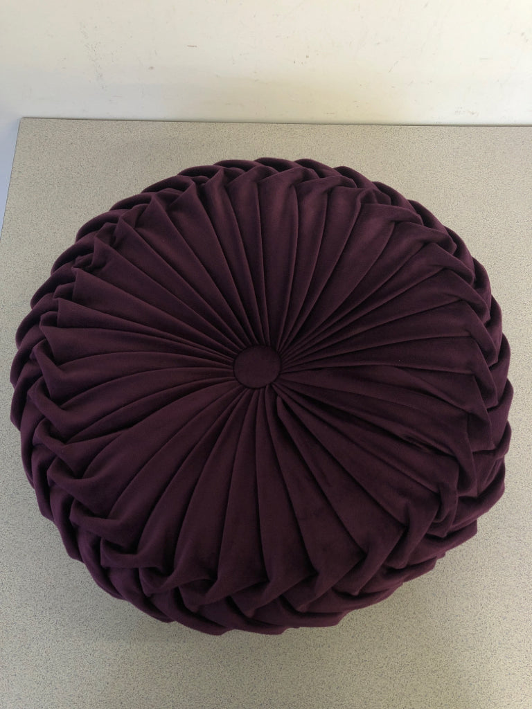 ROUND PURPLE RUFFLED PILLOW.