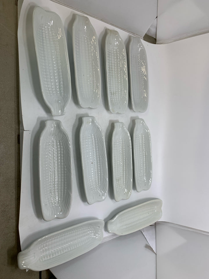 10 WHITE CERAMIC CORN ON THE COB HOLDER PLATES.