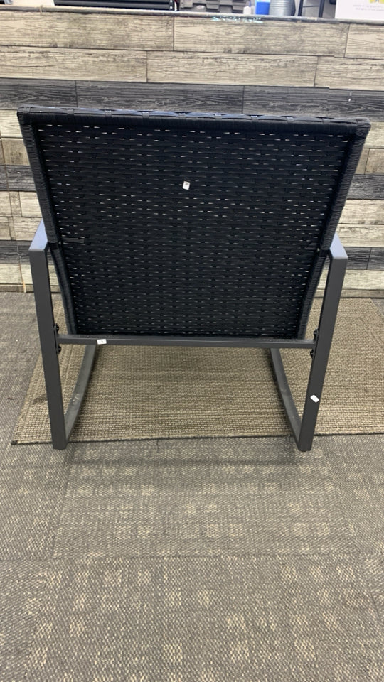 BLACK WICKER OUTDOOR ROCKING CHAIR.