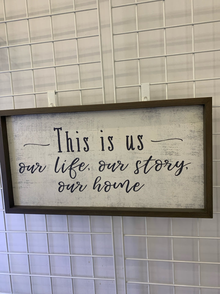 "THIS IS US" WALL ART GRAY WOOD BORDER W/ DISTRESSED BACKGROUND.