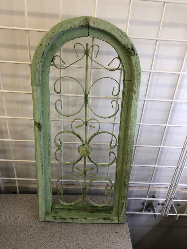 DISTRESSED GREEN PAINTED ARCH W/ METAL SCROLL WALL ART.