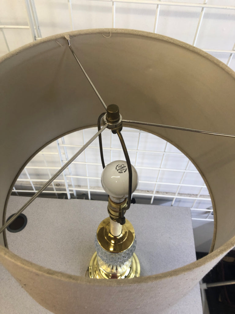 GOLD METAL BASE W/ GLASS MIDDLE + TAN SHADE LAMP.