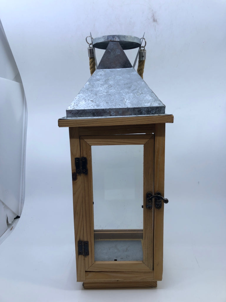 SILVER METAL AND BLONDE WOOD LANTERN ROPE HANDLE.