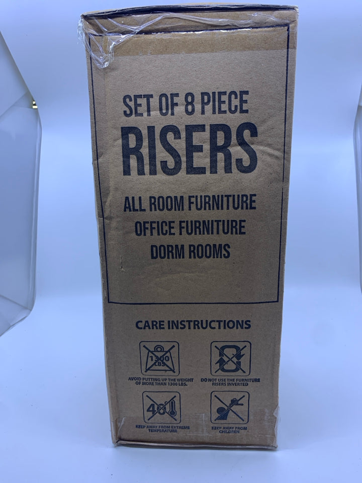 NIB FURNITURE RISERS.