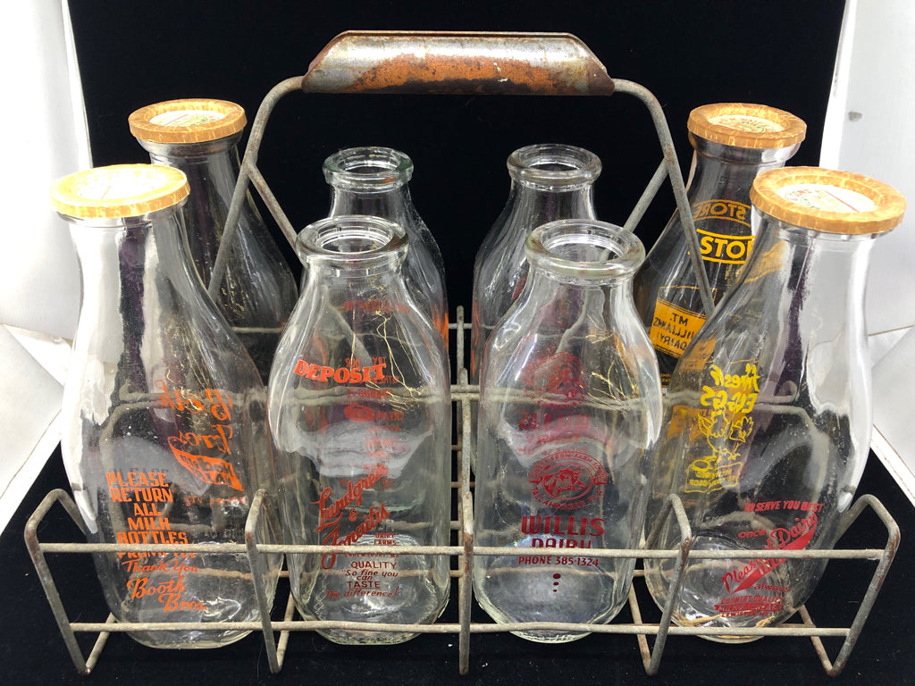 METAL CRATE + 8 DECORATIVE VTG MILK BOTTLES.
