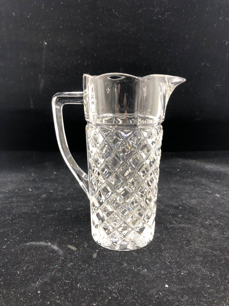 SMALL HEAVY GLASS PITCHER W HANDLE.