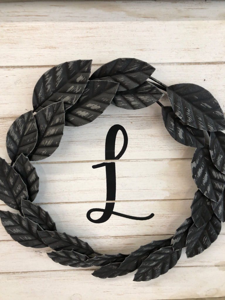 "L" IN RUSTIC LIGHT GREY WOOD FRAME.