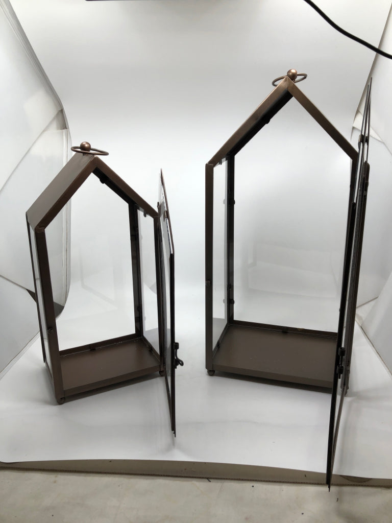 2 BROWN METAL CANDLE LANTERNS.