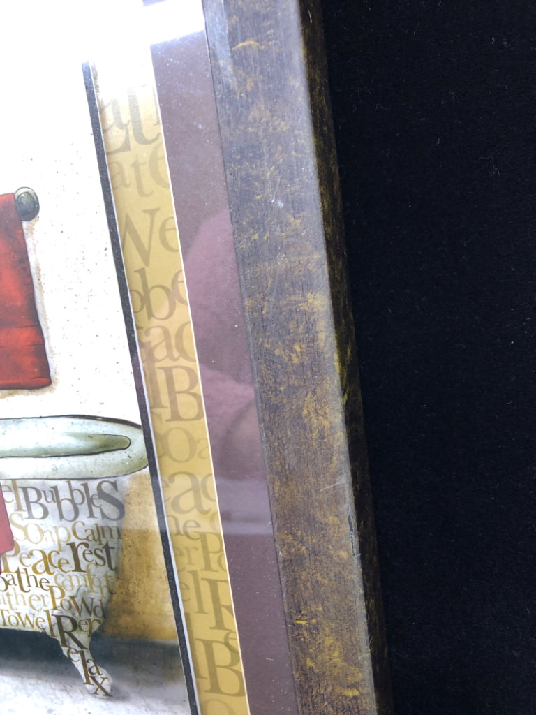 BATHTUB W WORDS AND RED TOWELS.