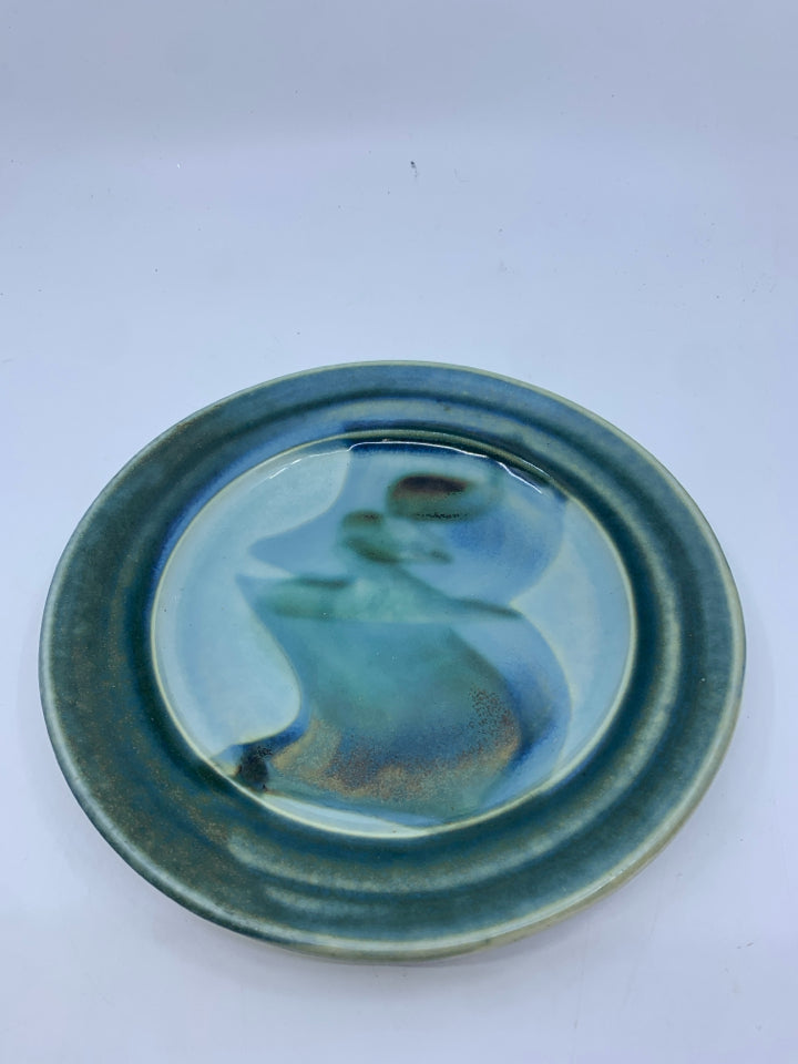 TEAL AND LIGHT BLUE POTTERY PLATE.