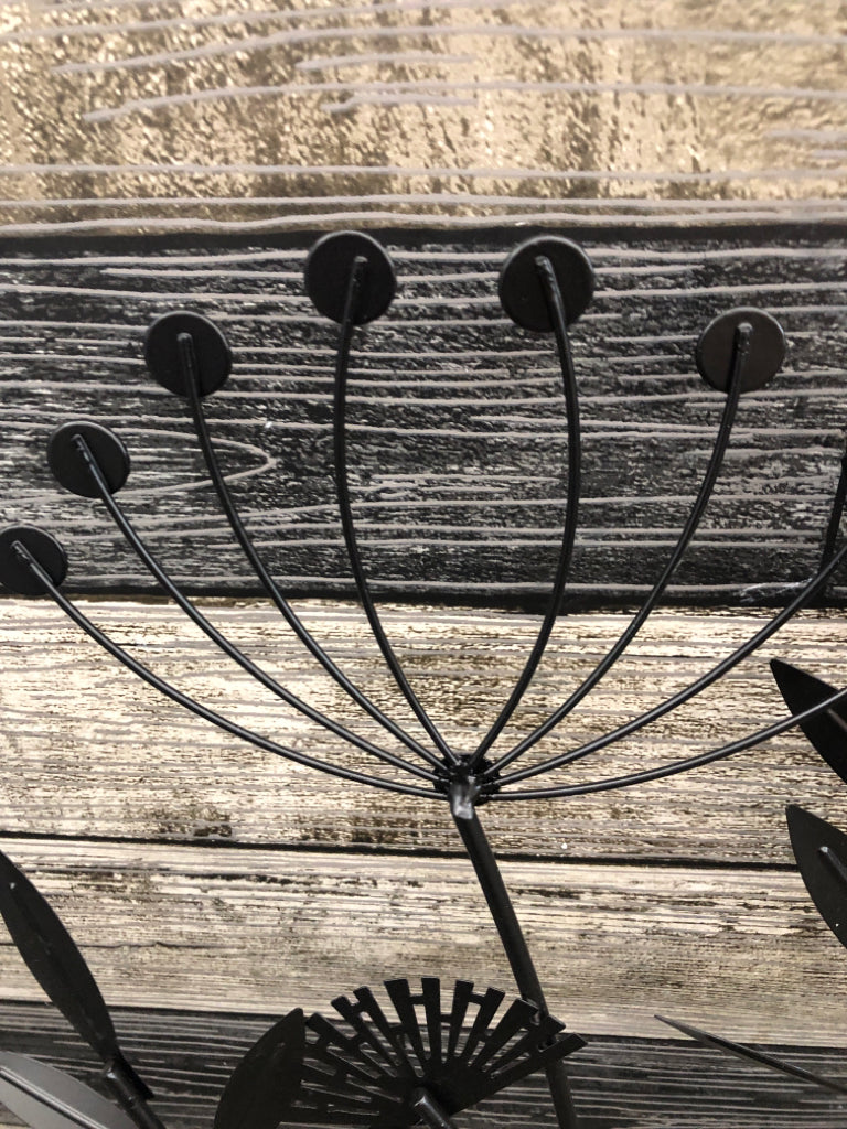 BLACK METAL DANDELION AND LEAVES WALL HANGING.