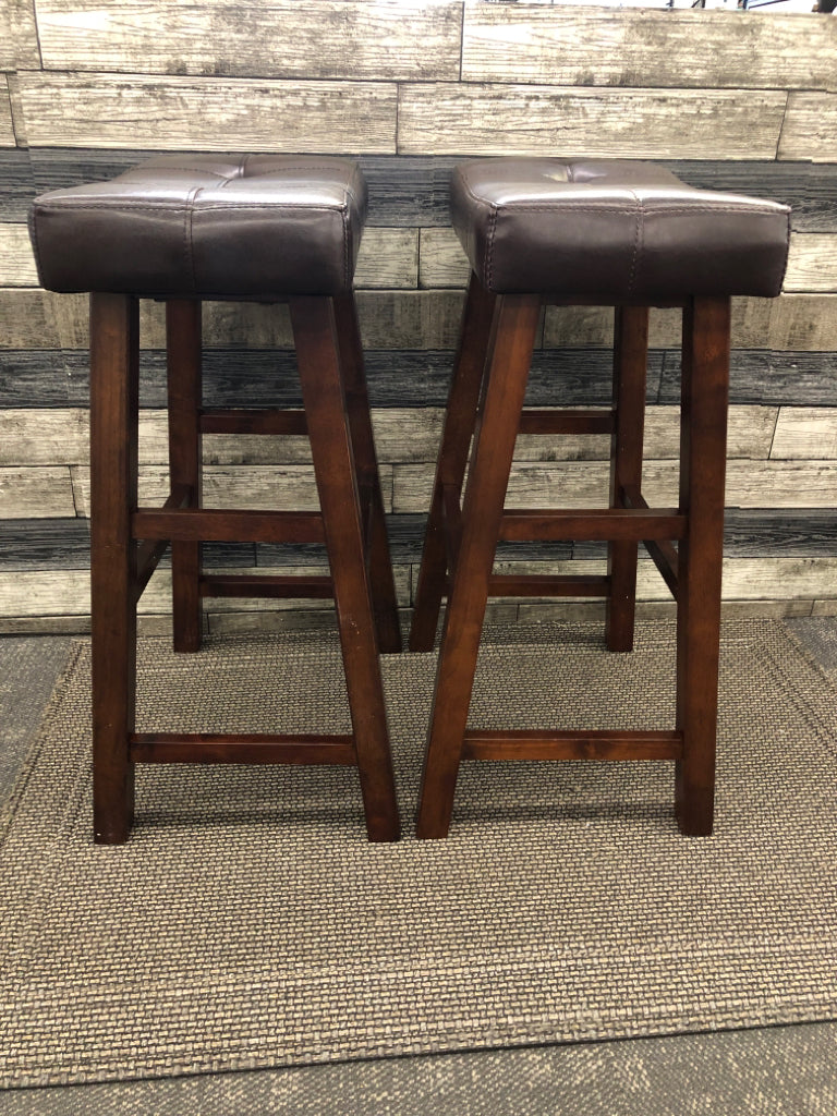 2 LEATHER SADDLE BAR STOOLS.